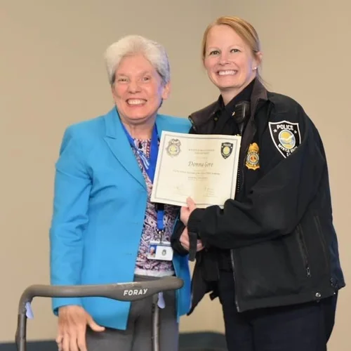 Donna R. Gore receiving an award